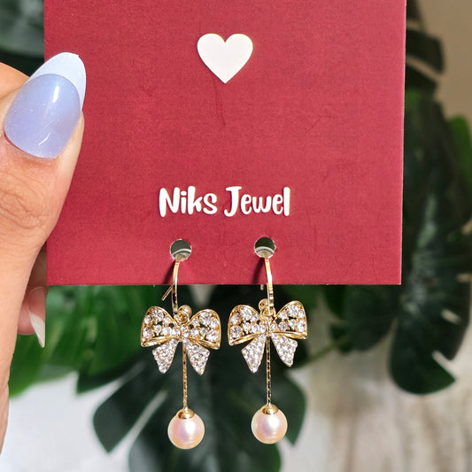 Elegant Bow Pearl Hoop Earrings.
