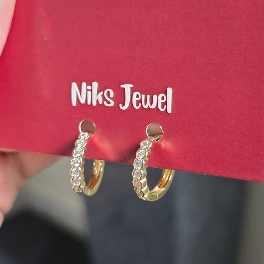 Gold-Tone CZ Huggie Hoop Earrings.