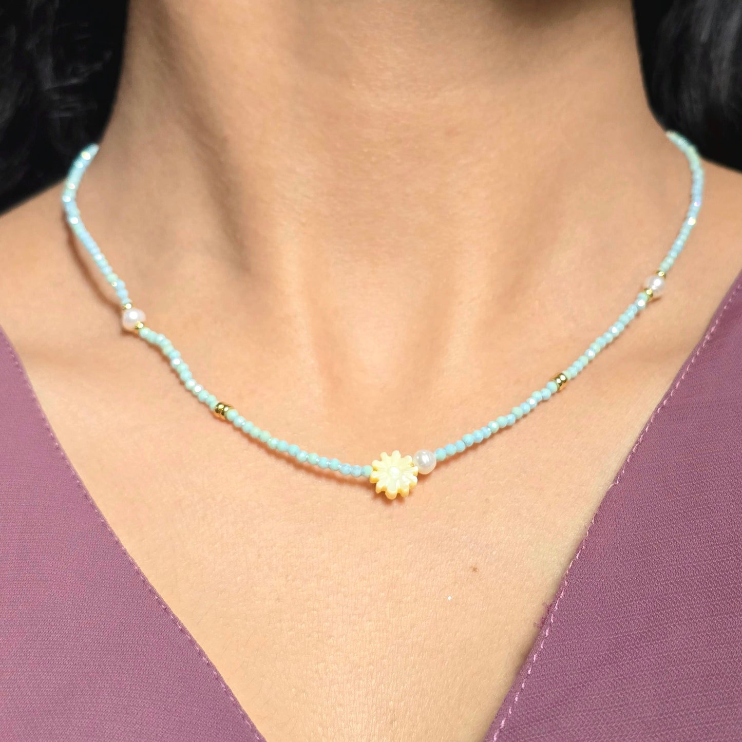 Sky Blue Beaded Necklace with Floral Charm and Pearl Accent.