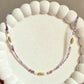 Amethyst Beaded Necklace with Gold and White Accents.