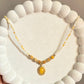 Yellow Beaded Necklace with Sunburst Oval Pendant.