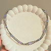 Double Strand Metallic Beaded Necklace with Iridescent Stone Accents.