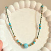 Turquoise Beaded Necklace with Pearl and Gold Spacer Accents.