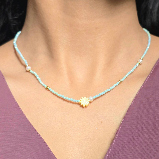 Sky Blue Beaded Necklace with Floral Charm and Pearl Accent.
