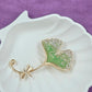 Gold-Tone Leaf Pin with Green and White Crystals