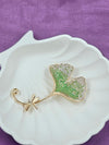 Gold-Tone Leaf Pin with Green and White Crystals